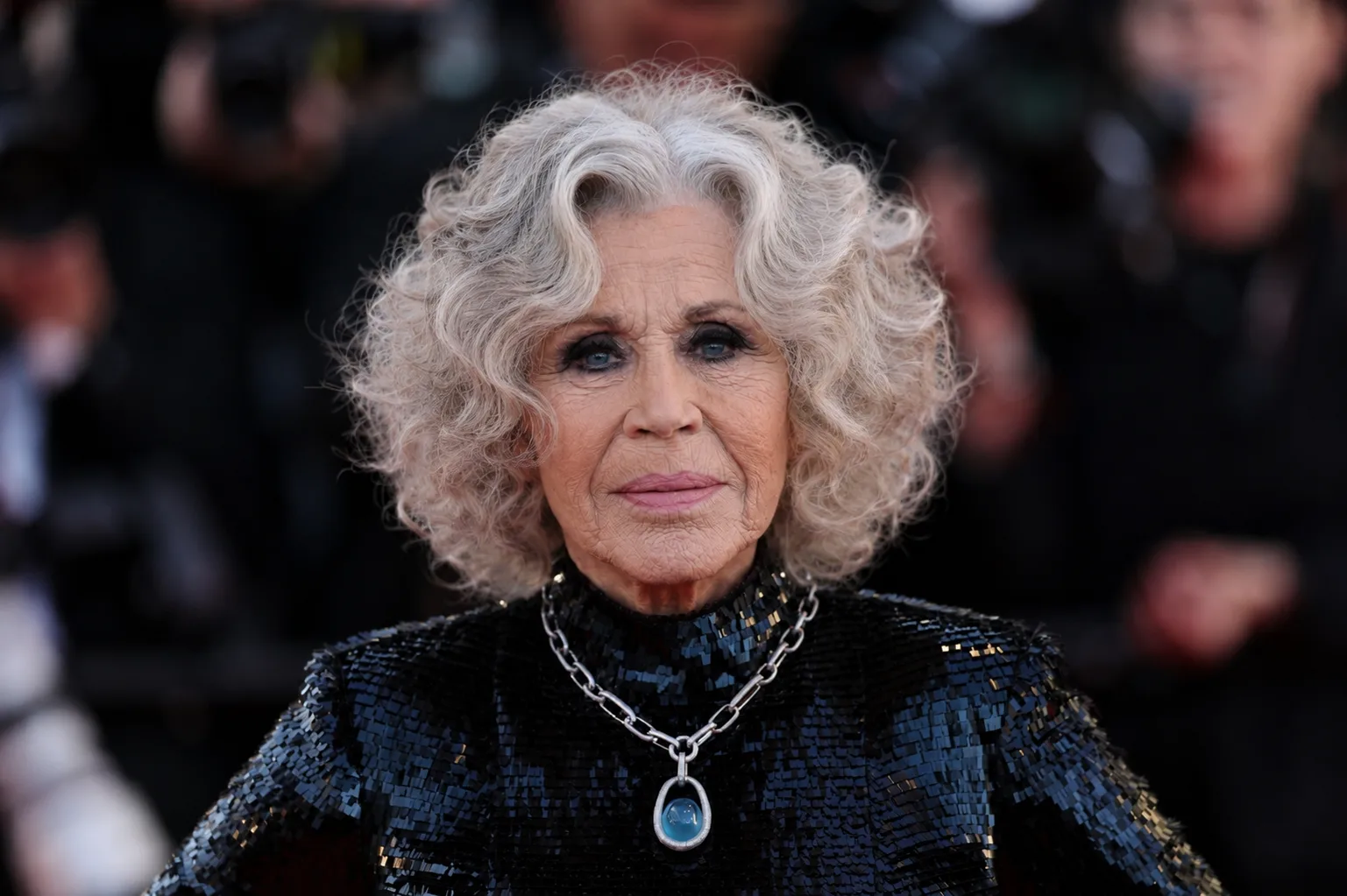 This portrait presents a more mature interpretation of Fonda, highlighting natural changes to the face and neck over time.