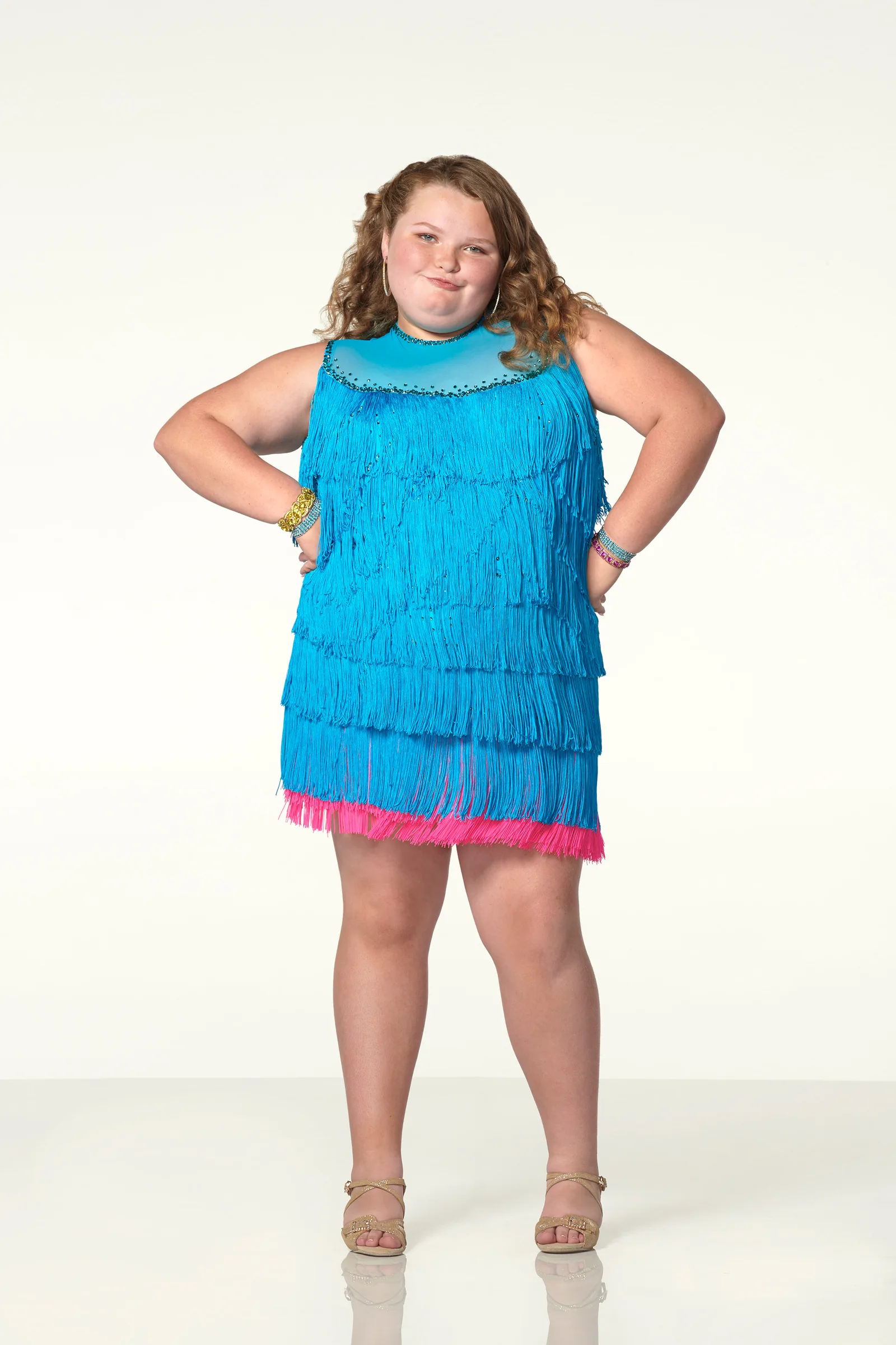 Alana "Honey Boo Boo" Thompson strikes a sassy pose in a bright blue fringed dress during a promotional photoshoot for "Dancing with the Stars: Juniors" in July 2018.