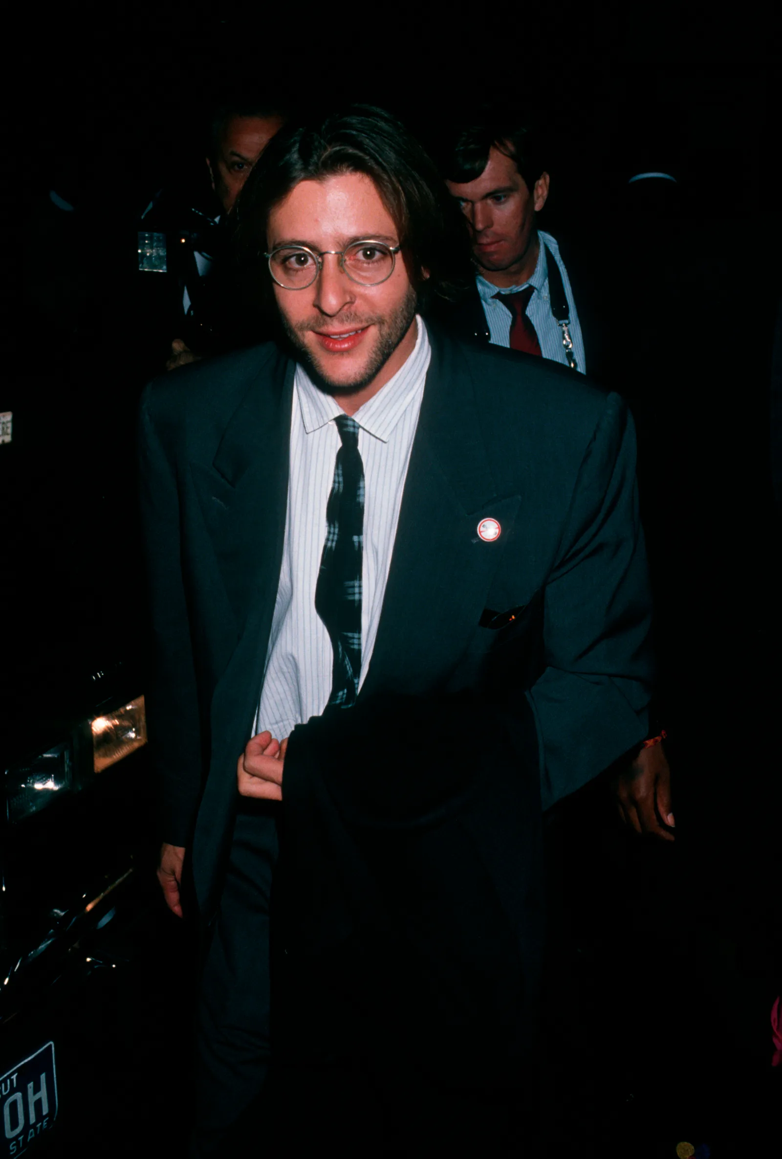 Wearing round-frame glasses and a dark suit, the actor arrives at the Ziegfeld Theater in New York City for the premiere of "Old Gringo."
