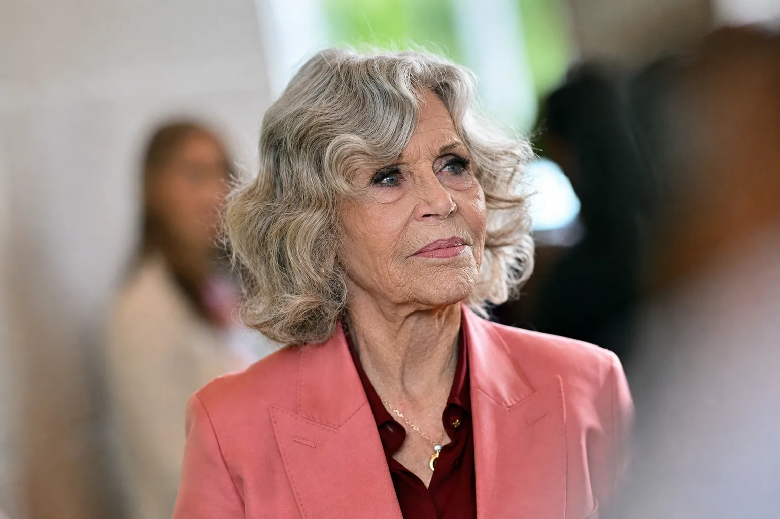 The AI visualization shows a progression of natural aging through deeper wrinkles and subtle loss of facial volume.