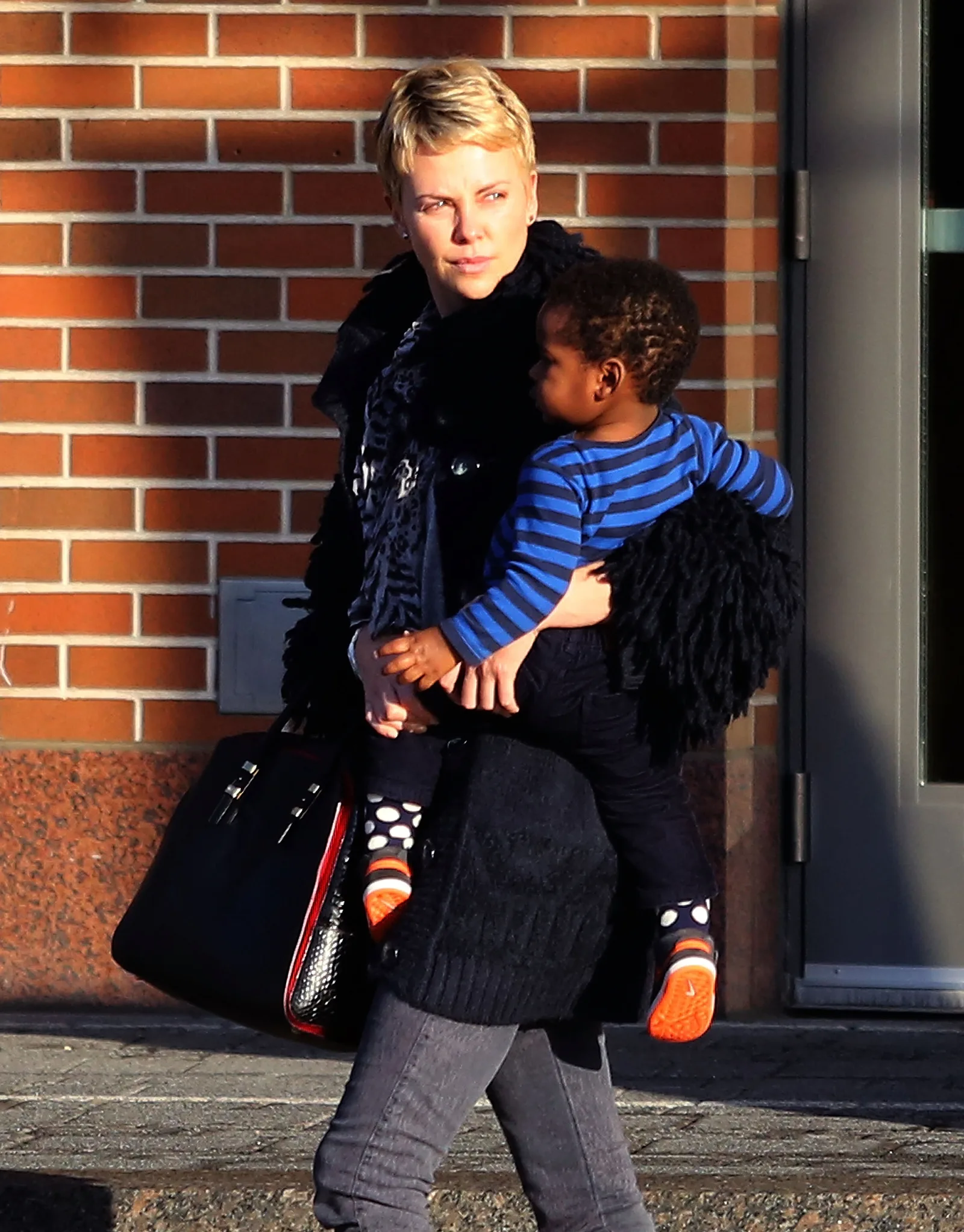 Charlize Theron kept her kids' early childhood mostly out of the public eye. During this outing, she was seen with Jackson Theron on March 24, 2013, in Boston, Massachusetts.