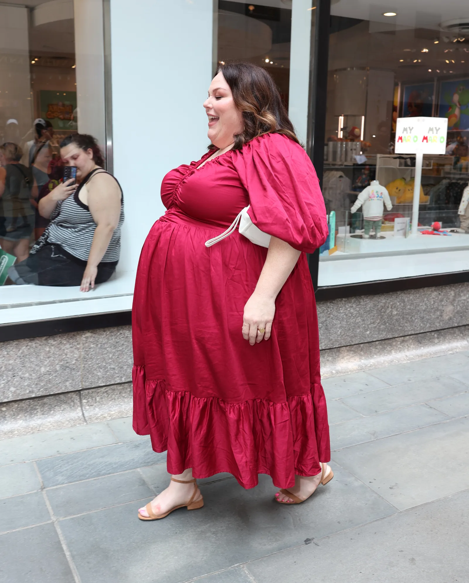 In August, Metz was photographed walking in New York in a deep red dress with puff sleeves and a ruffled hem. The image was taken around the time she publicly discussed her GLP-1 journey and the 63-pound loss reported by Ro.