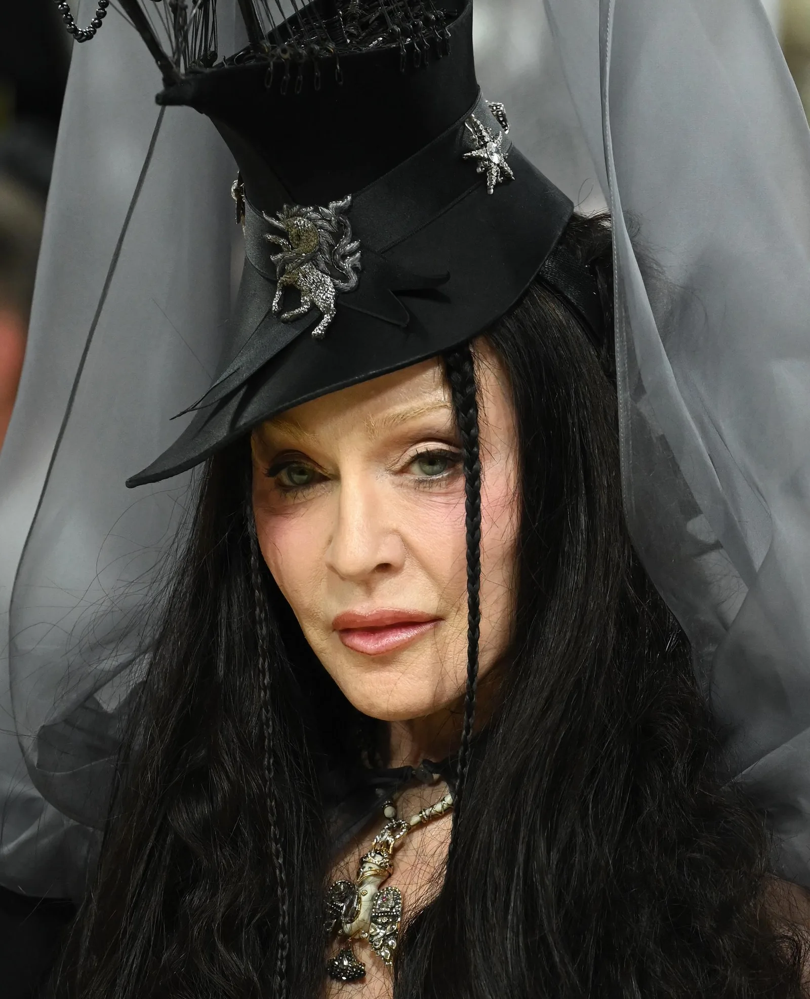 Madonna attends the 2026 Met Gala at the Metropolitan Museum of Art in New York City on May 4. She appeared with long black hair beneath an elaborate black hat and sheer veil, marking another dramatic transformation in her decades-long approach to fashion.