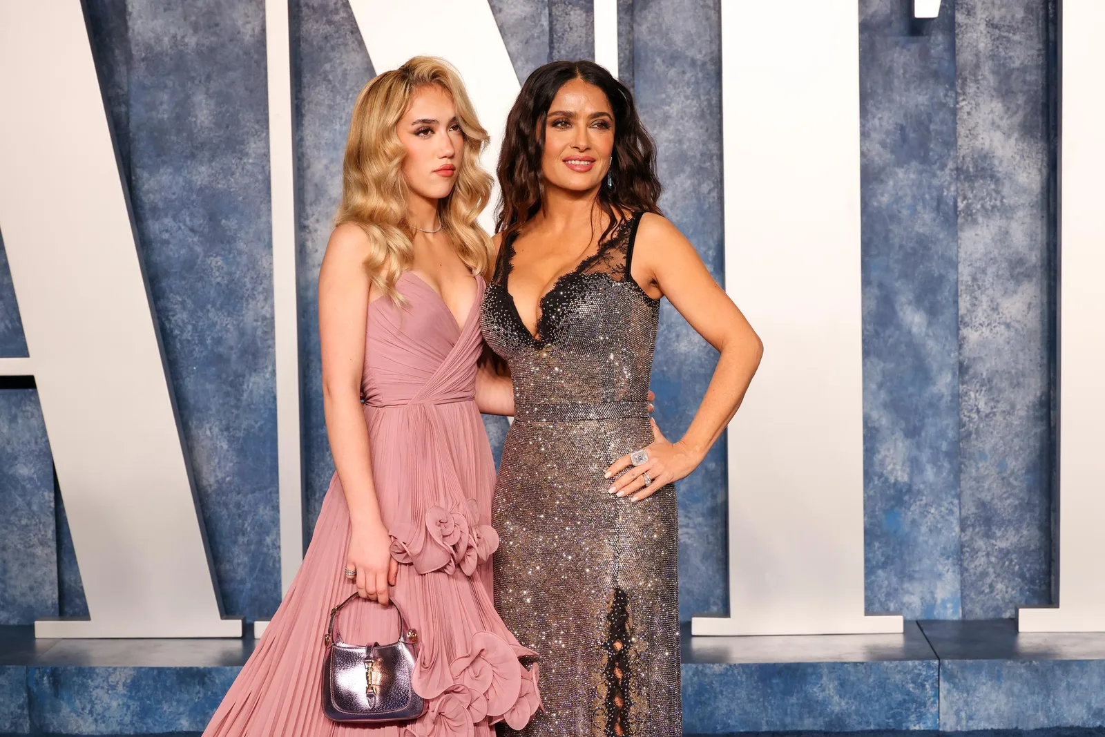 The Vanity Fair Oscar Party gave Valentina another chance to show her own taste. Her blush gown contrasted with Salma's silver-and-black dress, supporting her earlier point that she borrows from her mother's closet but still chooses her own look.