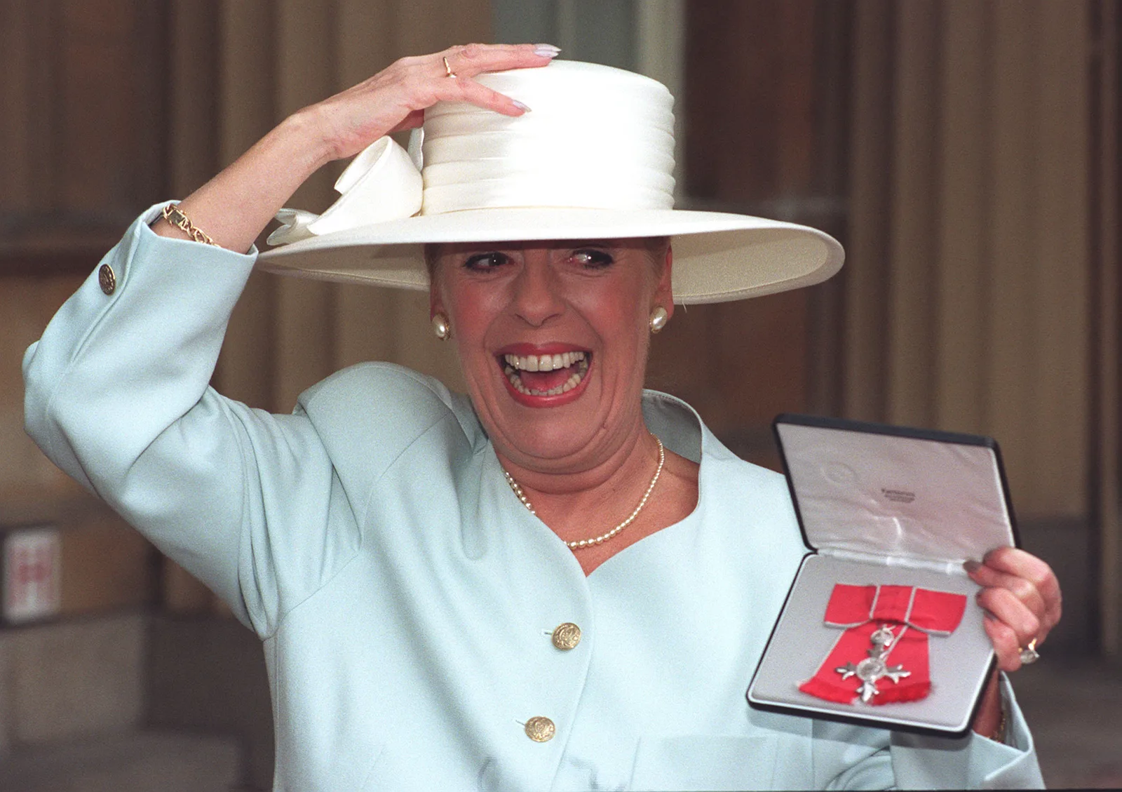 The actress pictured outside Buckingham Palace on February 20, 1996