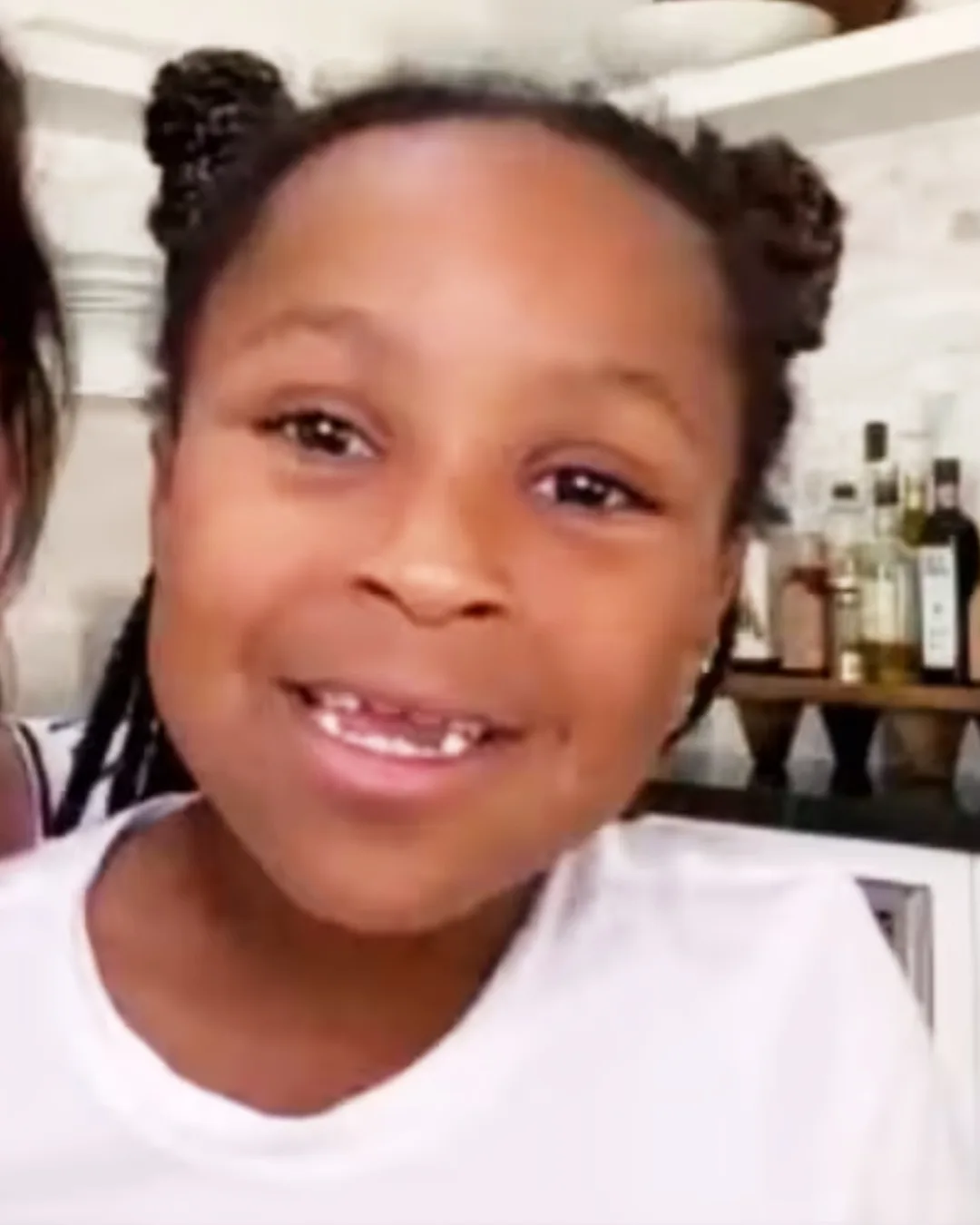 Laila smiling in her mom's lap as the two make an appearance on "Red Table Talk," posted May 8, 2020.