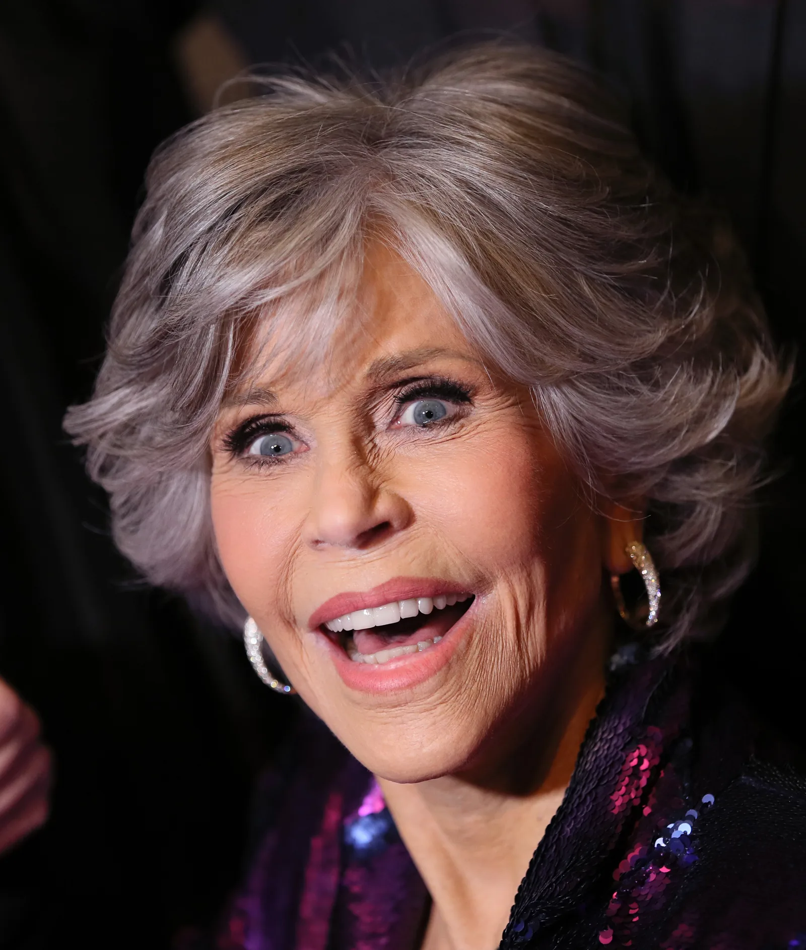 Jane Fonda smiles during a public appearance, several years after speaking openly about her experience with cosmetic surgery.