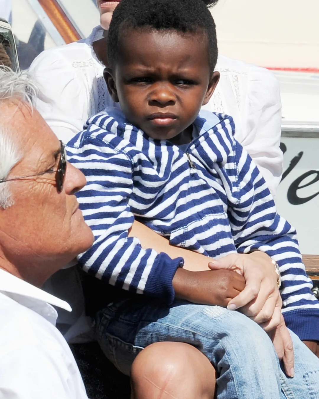 Louis Bardo sitting in his mom's lap at the 70th Venice International Film Festival in Italy on August 27, 2013.