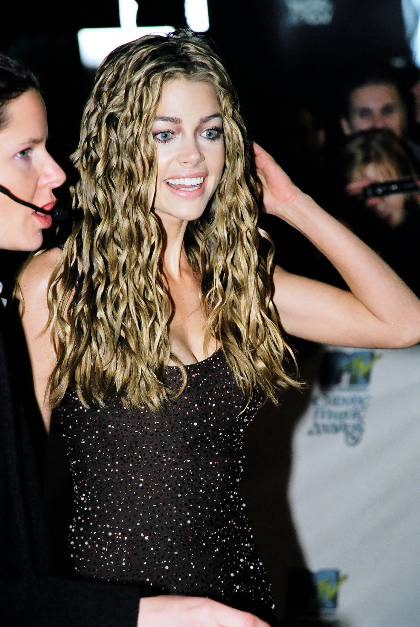 Richards embraced one of the decade's boldest hair trends during her ascent. Years later, images from her early career would help frame the goal of making her look refreshed rather than unfamiliar.