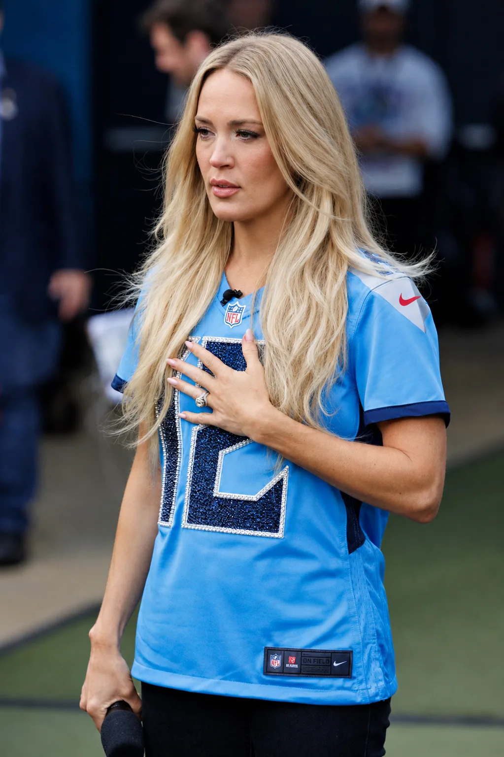 AI-rendered portrait envisioning Carrie Underwood with long blonde hair, subtle makeup, and softly defined facial features.