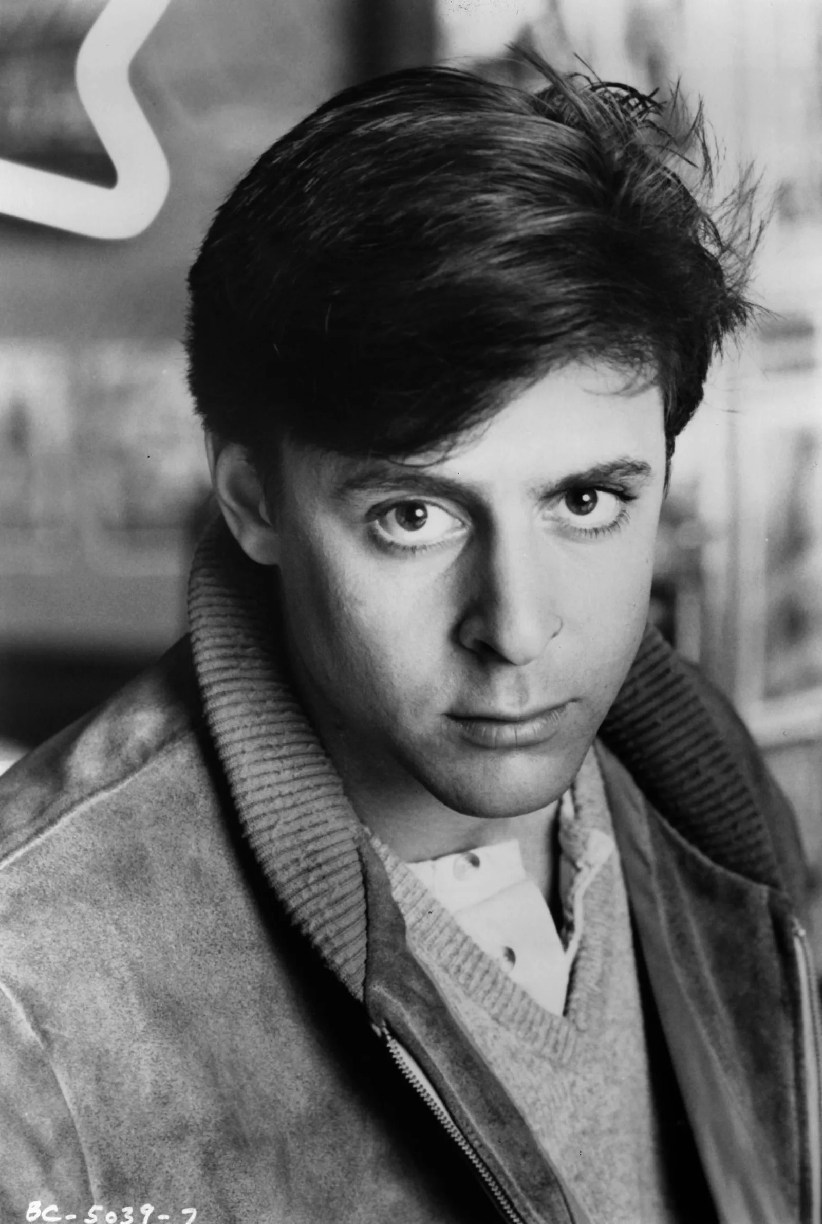 A classic 1985 studio publicity portrait taken during the release of "The Breakfast Club," capturing the iconic brood and teenage angst that helped define an entire generation of film fans.