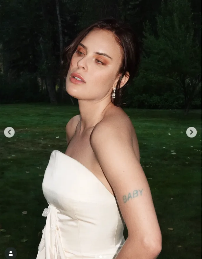Tallulah Willis models the strapless ivory gown in a closer look at its sculpted bodice and delicate detailing, offering another glimpse of the custom design before its full reveal.