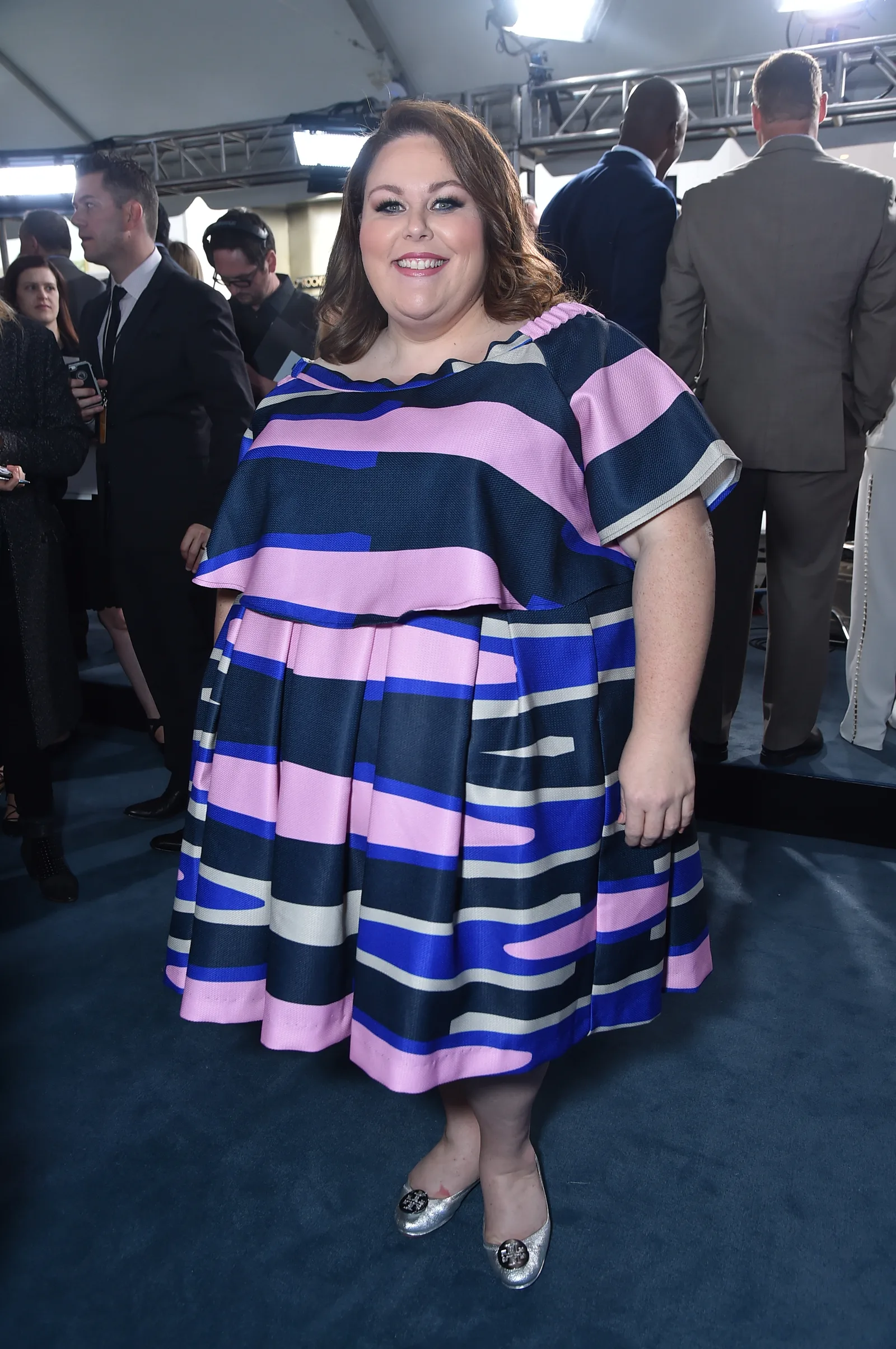 She appeared in a navy dress with pink, blue, and white stripes at the NBCUniversal Upfront. The look captures her during the period when "This Is Us" was quickly raising her public profile.