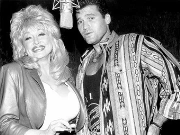 Billy Ray Cyrus recalled a 1992 tabloid rumor that linked him romantically to Parton, saying she brushed it off with a wink and joked, "Honey, this trash sells records!" Decades later, he remembered that moment as one example of her unmistakable humor.