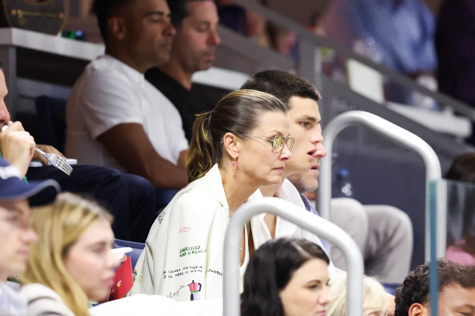 Bridget Moynahan and her son Jack watch the action from the stands during the 2026 US Open on August 30, 2026, in New York City, with Jack seated just behind his mother.