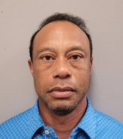 Tiger Woods posing for his booking photo after his arrest; photo provided by the Martin County Sheriff's Office in Stuart, Florida on March 27, 2026.