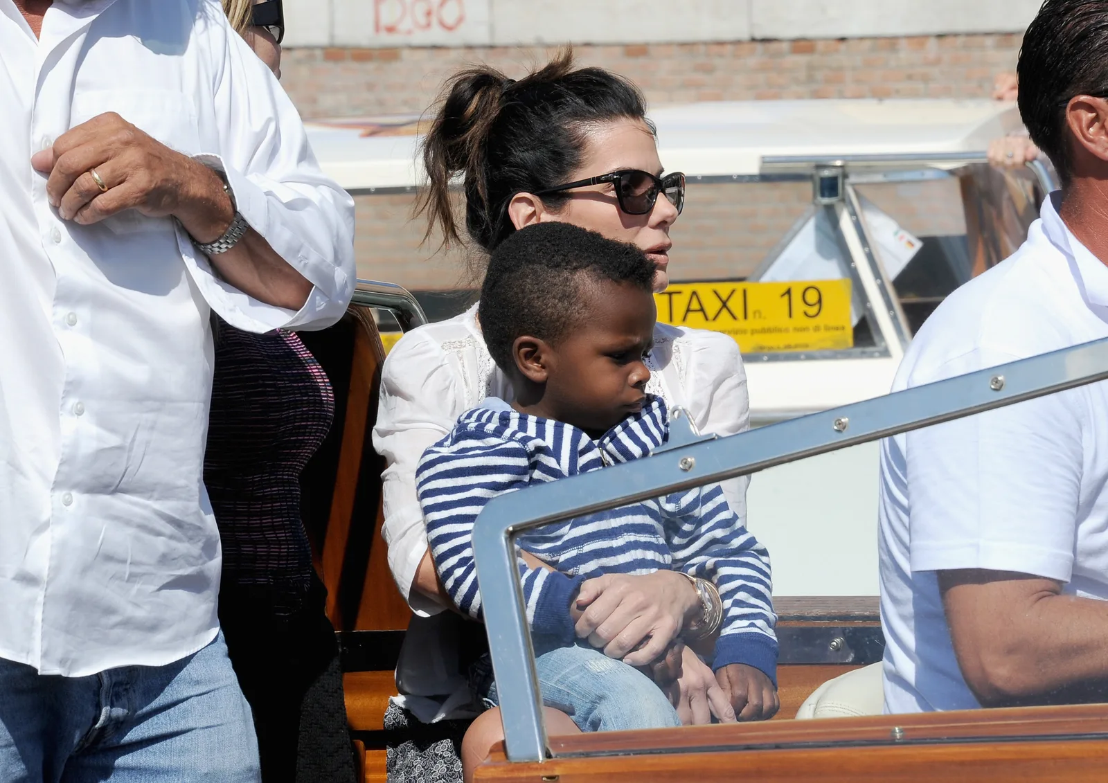 Sandra Bullock embraced added responsibility as she navigated raising her growing family in the public eye. During this outing, she and her son Louis Bardo Bullock attended the 70th International Film Festival on August 27, 2013, in Venice, Italy.