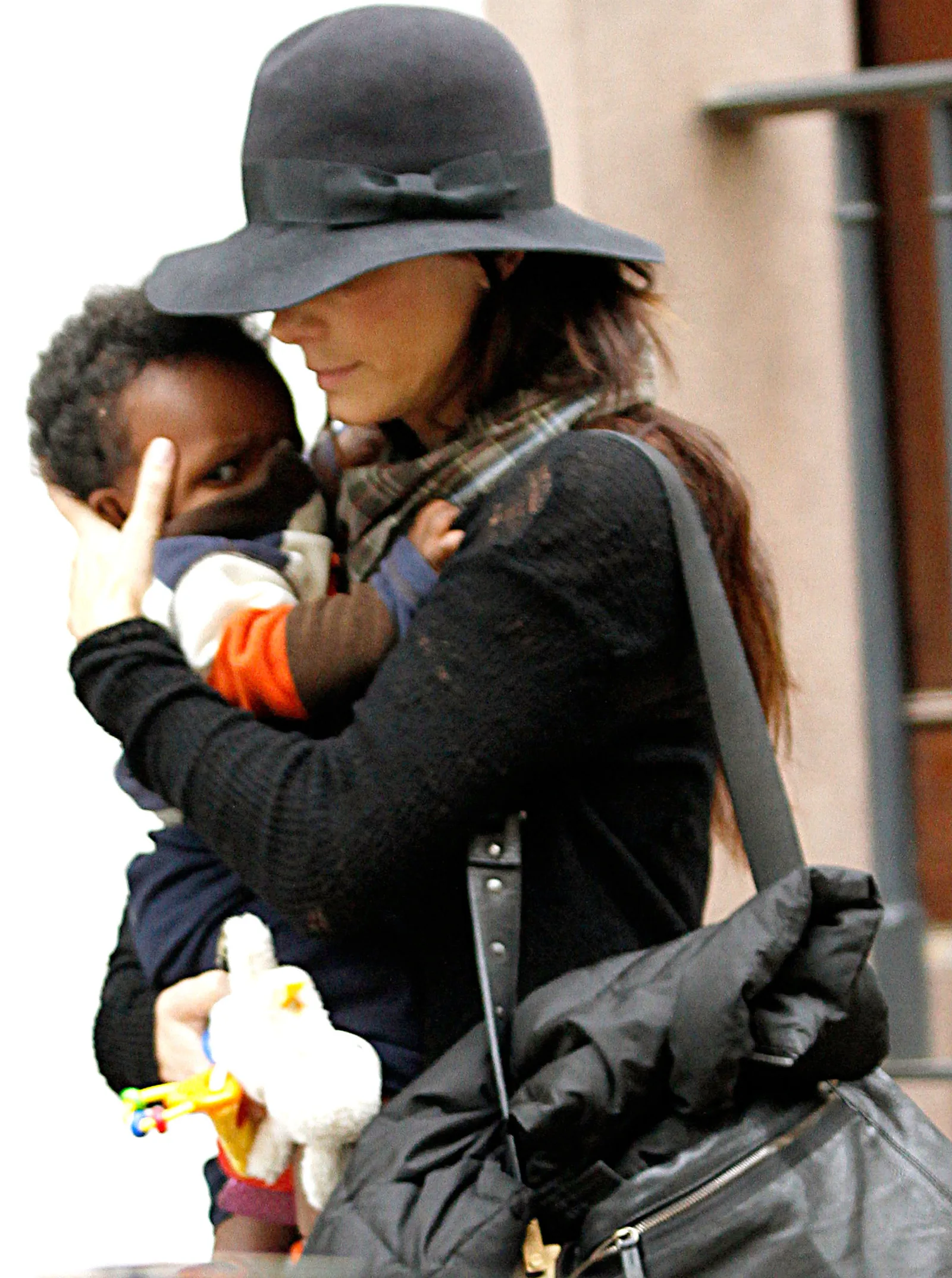 Sandra Bullock brought her children into the spotlight for the first time after making a rare revelation about them at the premiere of "Practical Magic 2." During this outing, she and her son Louis Bullock walked the streets of Manhattan on November 6, 2010, in New York City, New York.